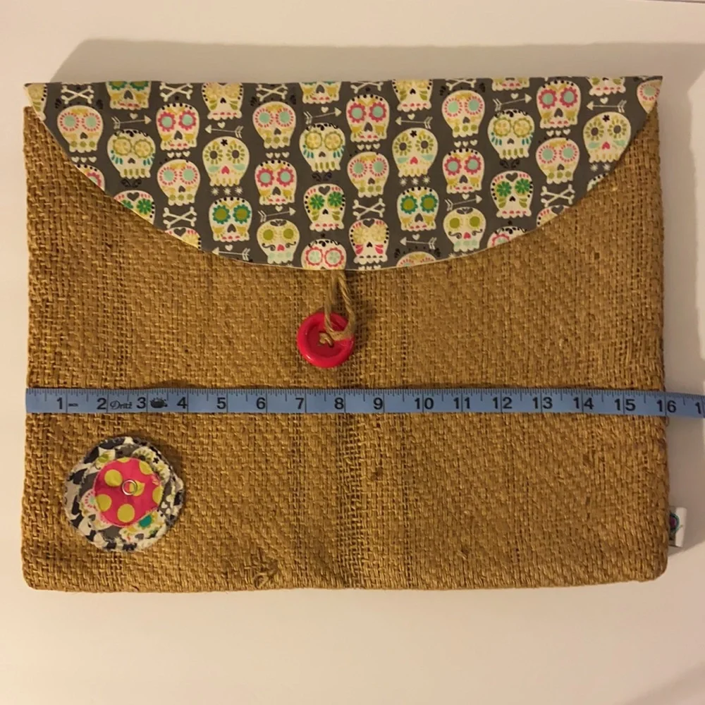 It’s a wrap burlap bag with sugar skulls, laptop bag, accessory bag
